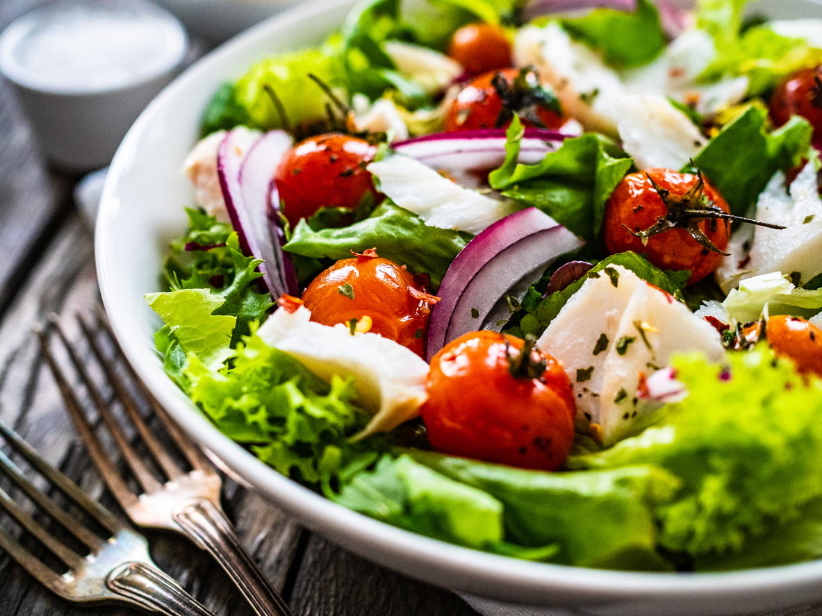 Roast fish and vegetable salad on wooden background Assisted Living & Memory Care | AVIVA Granbury Senior Living